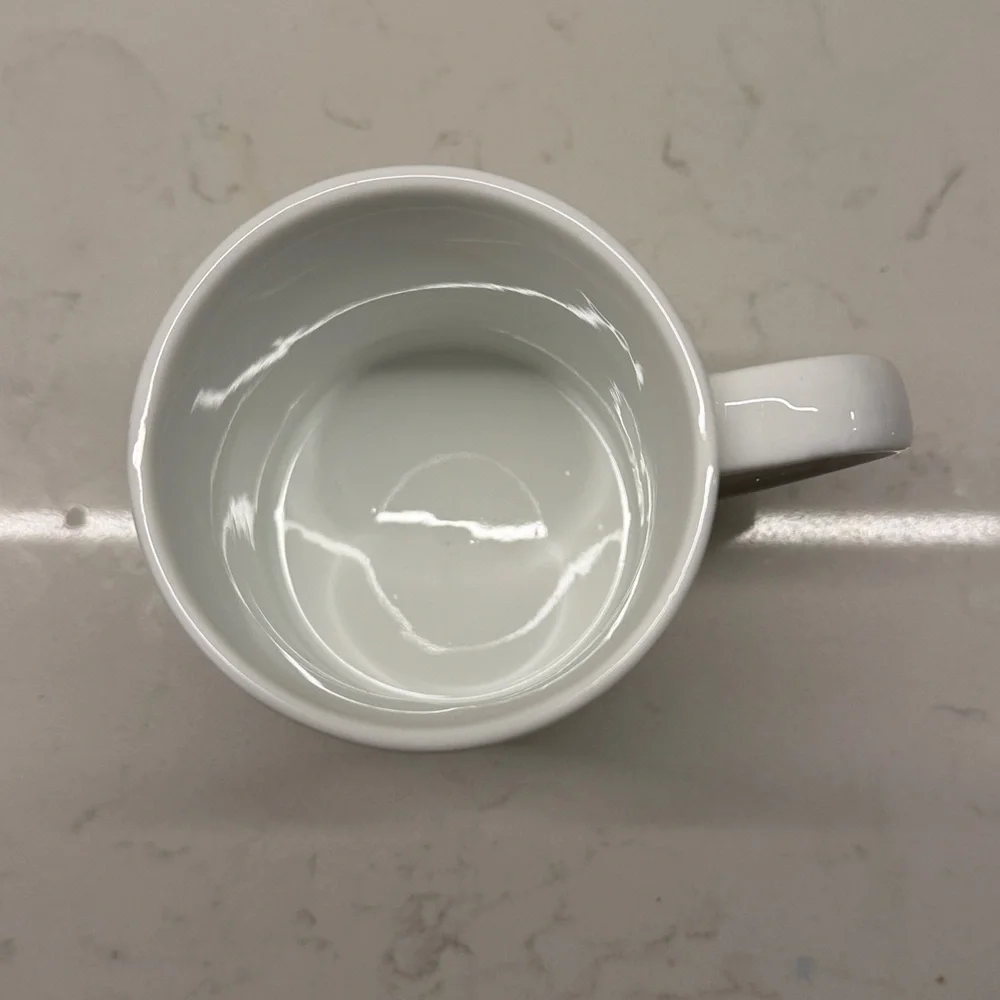 Schurman Retail Group “K” Initial White Monogrammed Mug with Black Lettering